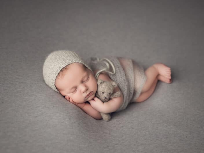 Newborn with teddy bear